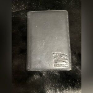 Burberry leather passport wallet.
